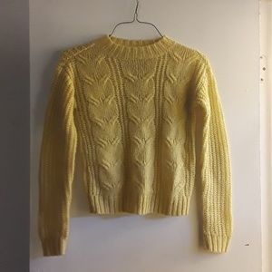 Yellow knit sweater.